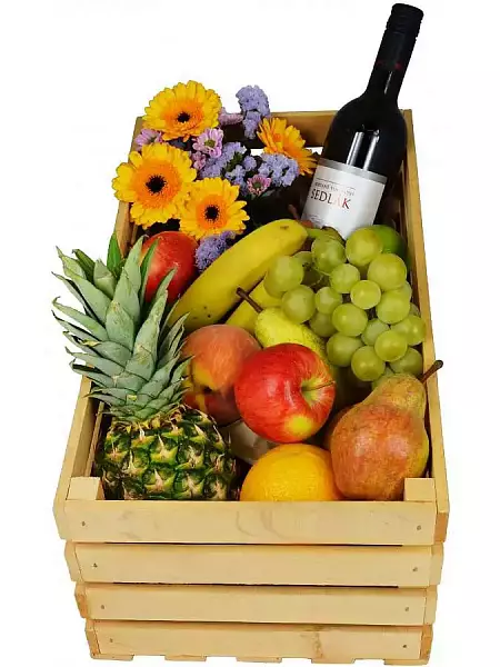 Wooden box with fruits and Sedlák wine